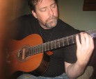 John playing guitar